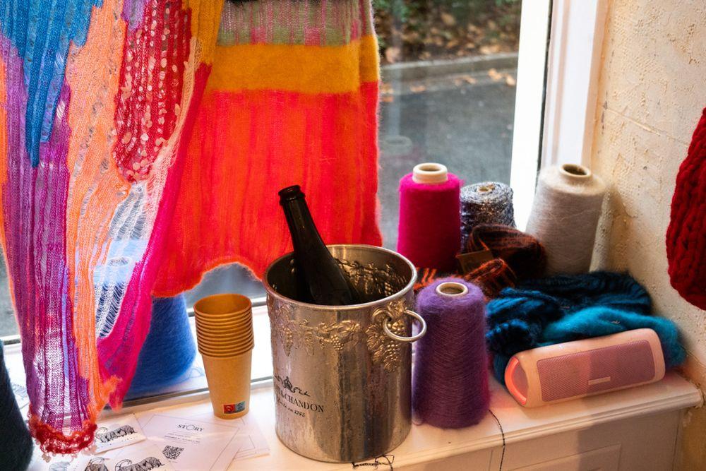 Champagne bucket and colorful knits at the House of Story Global showroom in Le Marais, Paris Fashion Week SS27