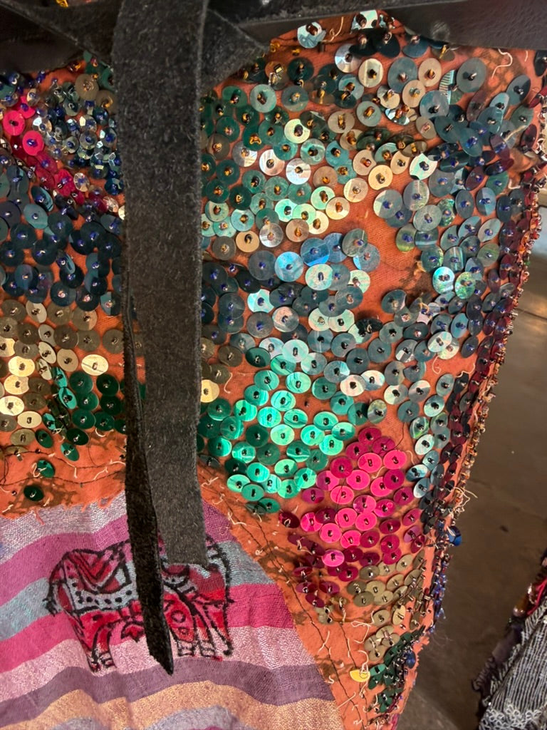 Plum sarong close-up of burgundy and purple sequins