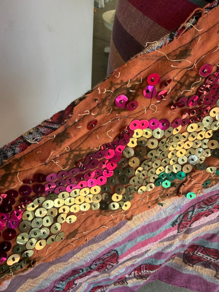 Plum sarong worn wrapped at the waist
